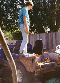 Al looking dejectedly at his rusty old tub